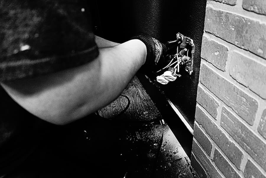 Electrician working on electrical outlet